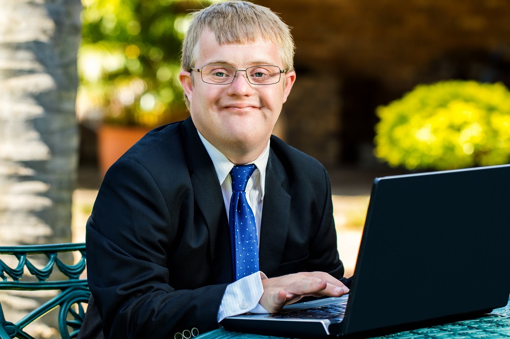 Disabled businessman with laptop